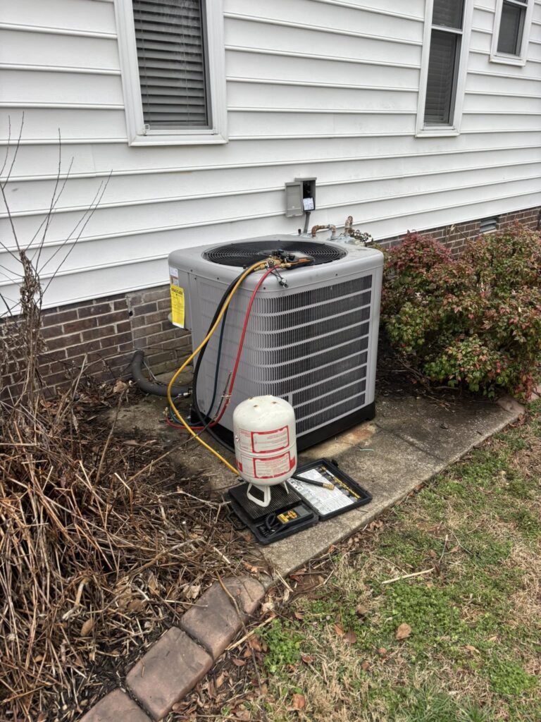 Outdoor HVAC unit against white siding Murfreesboro TN